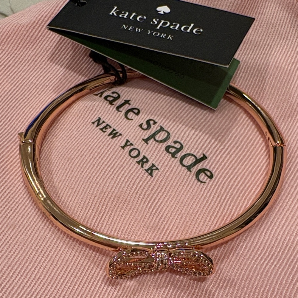 Rose gold Kate Spade bracelet with bow on top. Never used. Tag included.